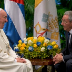 Pope Francis smiles as he visits with Cuba's President Raul Castro, in Havana, Cuba, Sunday, Sept. 20, 2015. Francis thanked Castro for his welcome at Havana's airport on Saturday and for the Cuban president's pardons for 3,522 prisoners convicted of relatively minor crimes, in their exchange before a private meeting. (Ismael Francisco/Cubadebate Via AP)